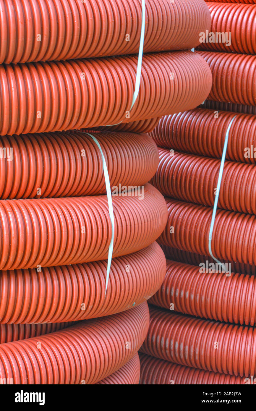 Red plastic tubing underground cable hires stock photography and