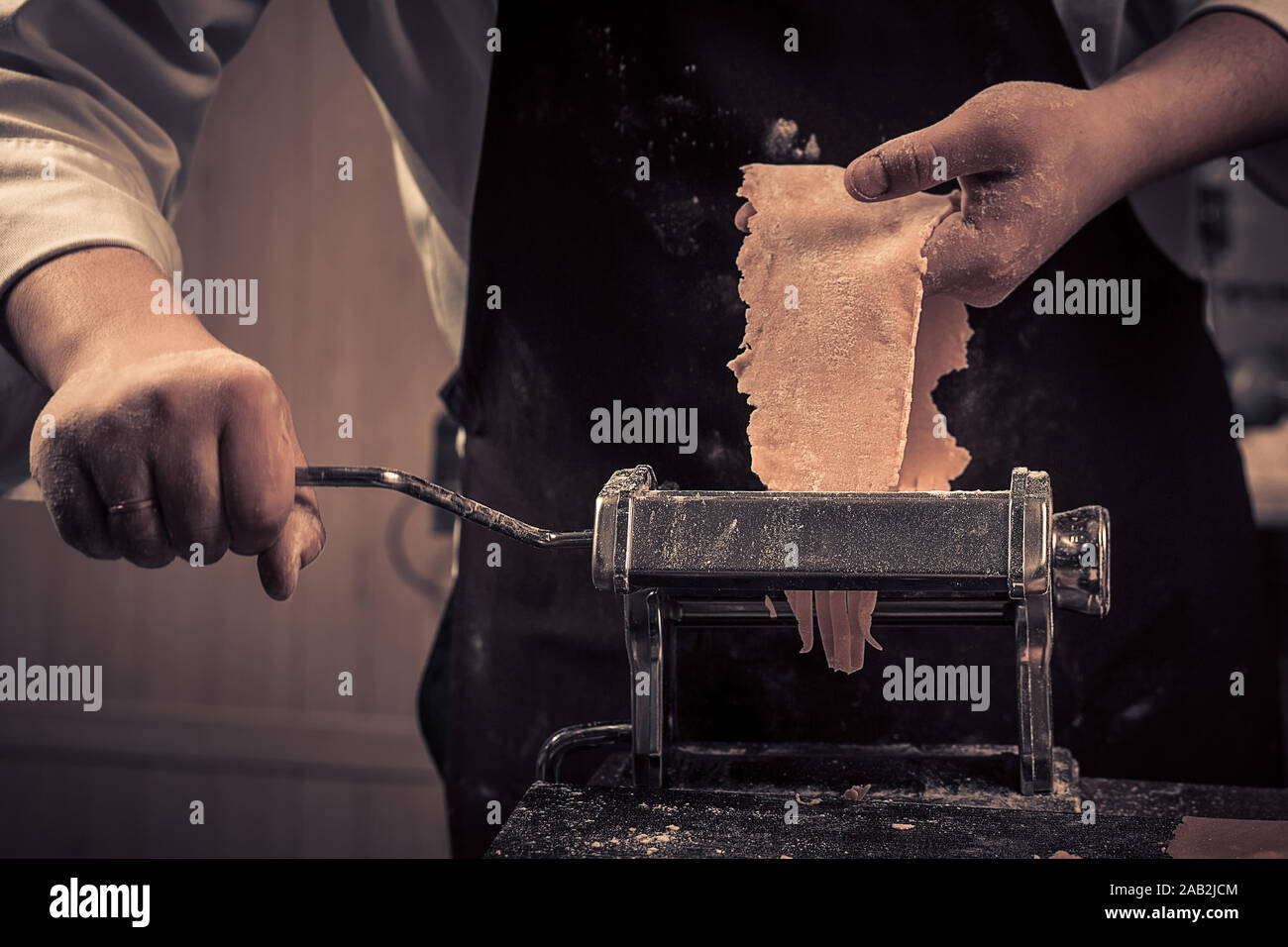 The chef makes fresh spaghetti from scratch. Stock Photo
