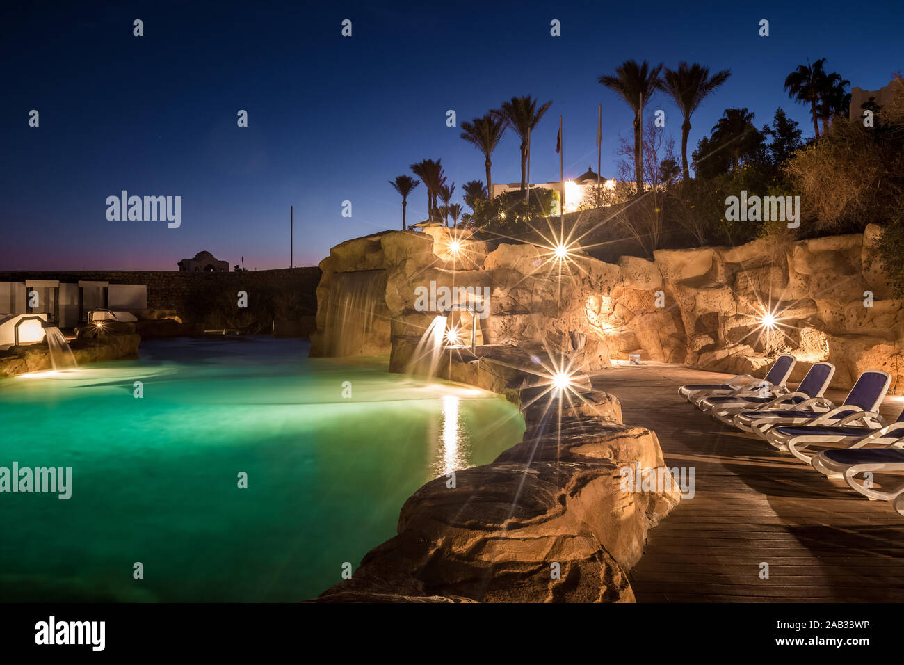 Long exposure shot of swimming pool at luxury night illumination Stock Photo