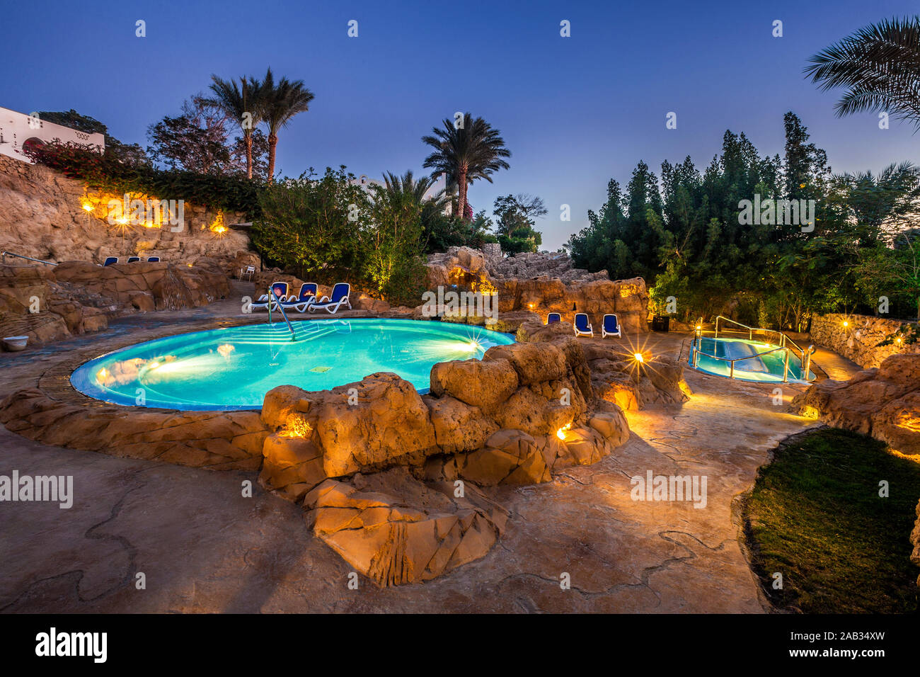 Evening view for luxury swimming pool in night illumination Stock Photo