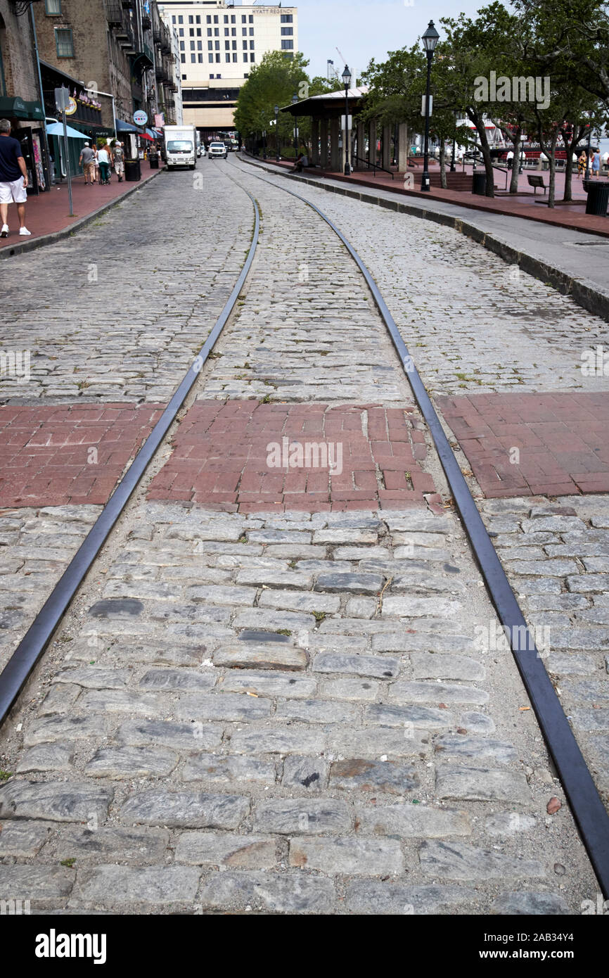 old streetcar rails embedded in the road in river street savannah georgia usa Stock Photo