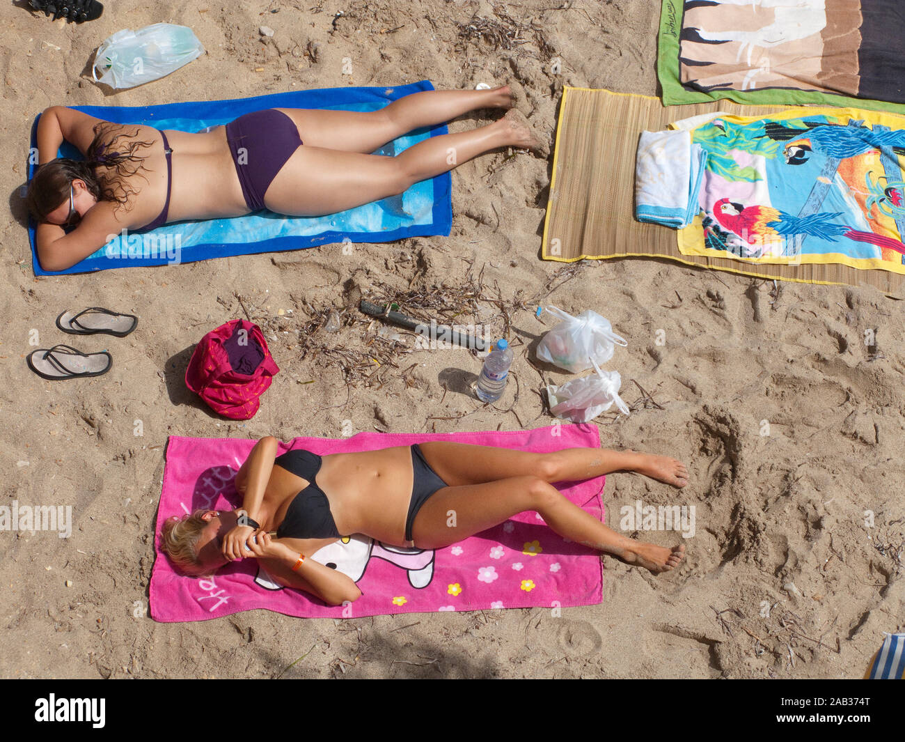 Girls sun bathing at beach Playa de Palma, El Arenal, Mallorca, Balearic islands, Spain Stock Photo