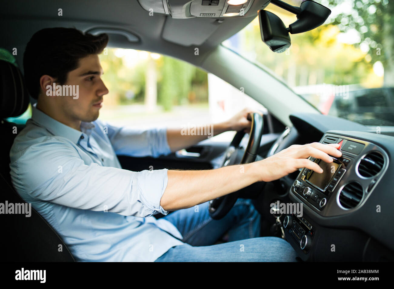 presses the emergency stop button in the car Stock Photo