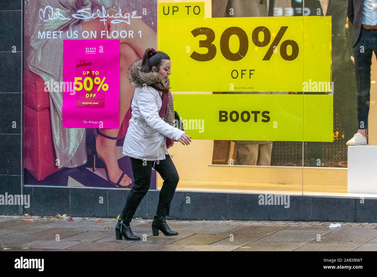 30% off boots and footwear in Preston, Lancashire. UK Weather. November,  2019. Wet blustery day for Black Friday Event shoppers in Preston city  centre as Miss Selfridge Black Tag sales get underway