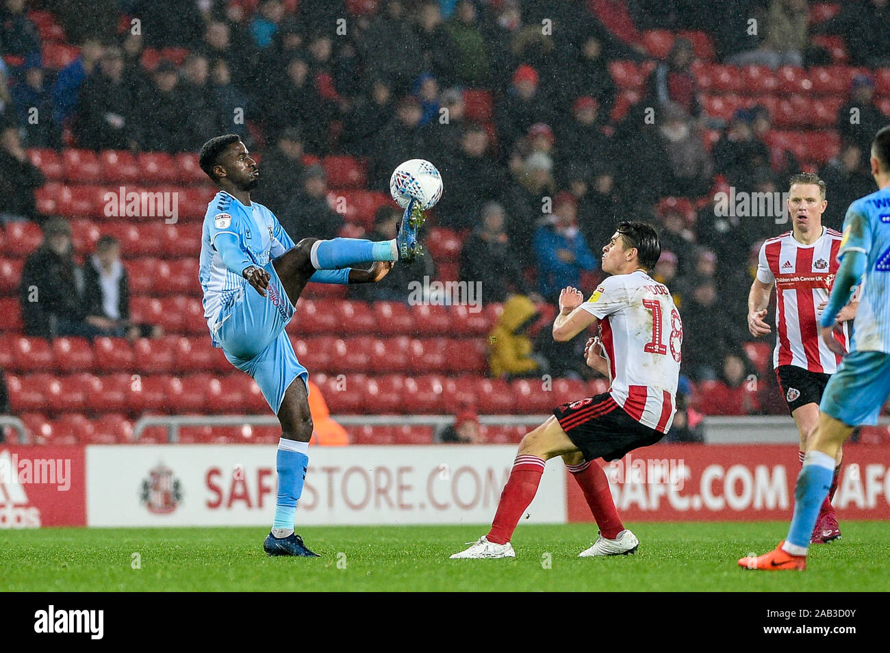 23rd November 2019, Stadium Of Light, Sunderland, England; Sky Bet League 1, Sunderland v Coventry City : Jordy Hiwula (11) of Coventry City controls the ball in front of George Dobson (18) of Sunderland Credit: Iam Burn/News Images Stock Photo