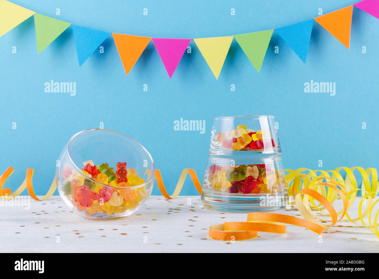 jelly candy in glass bowl on blue party background Stock Photo Alamy