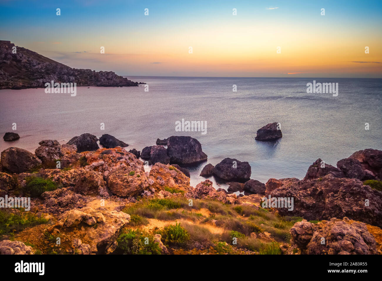 beautiful sunset and seascape view of Golden Bay in Ghajn Tuffieha ...