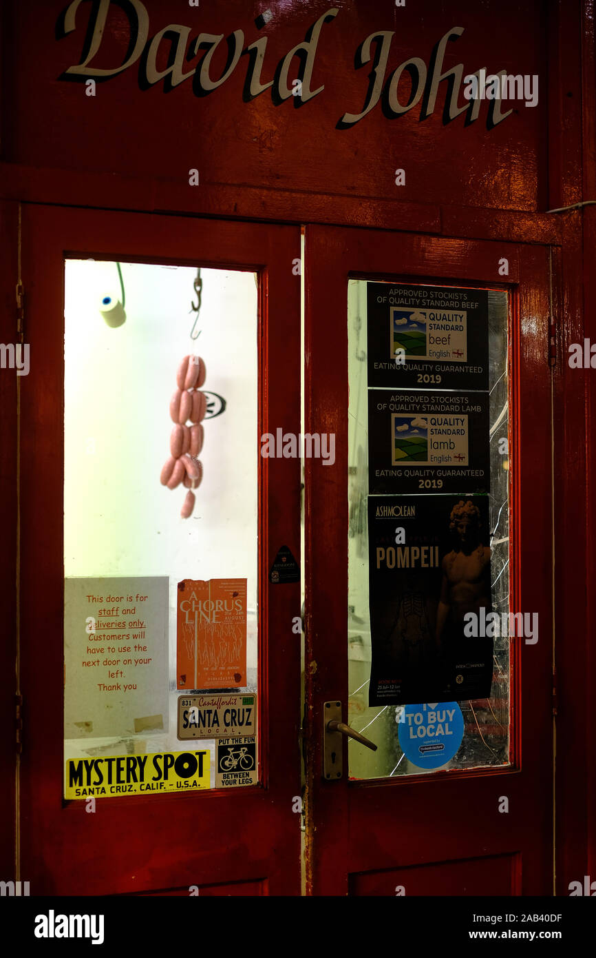 Sausages hanging on a hook at David John Butchers in Oxford's Indoor Market Stock Photo