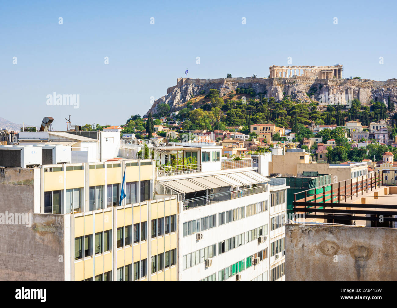 Relatively new buildings overlooked by the Acropolis, Athens, Greece Stock Photo