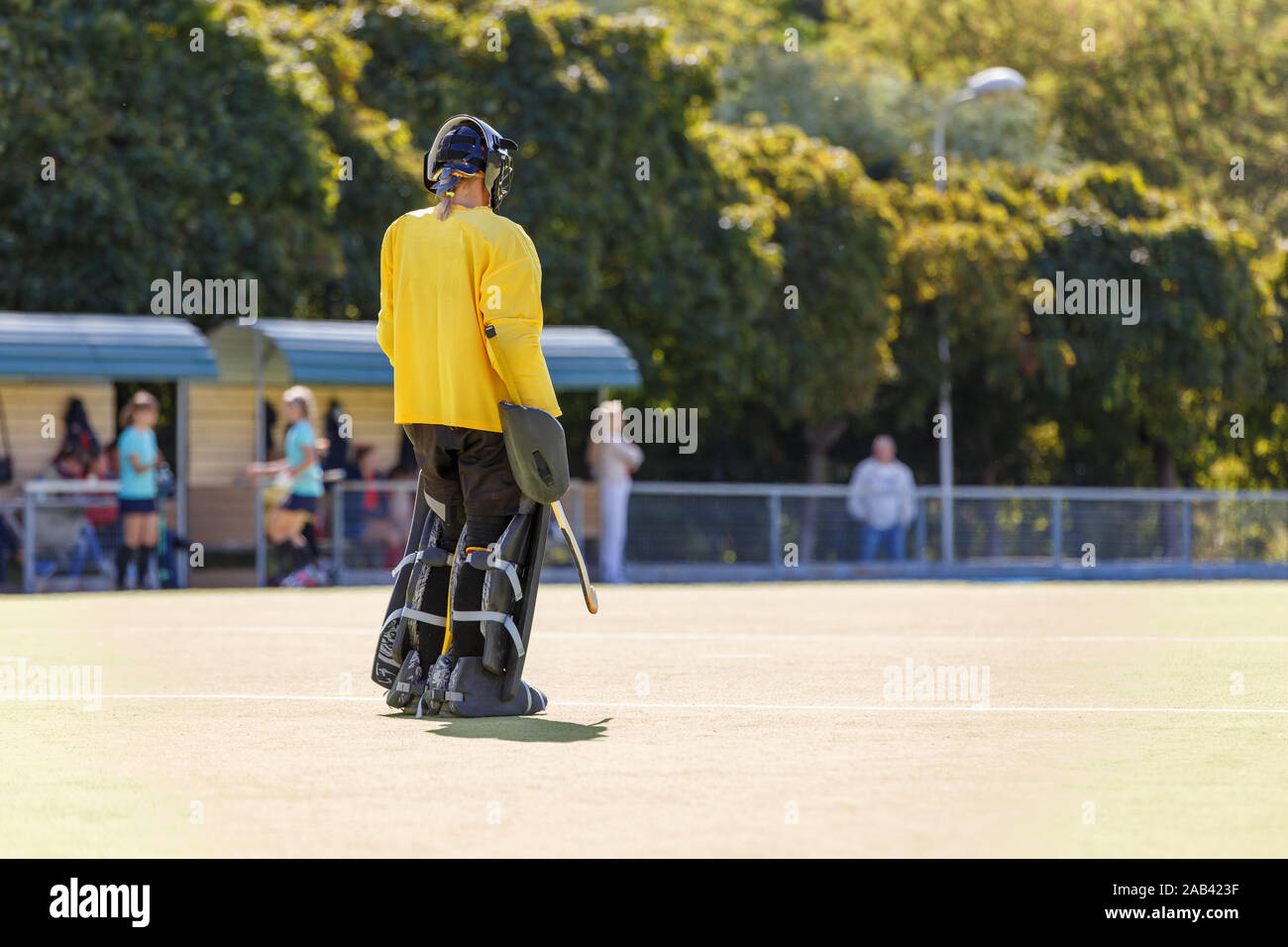 Field hockey female goalkeeper standing on the field Stock Photo Alamy