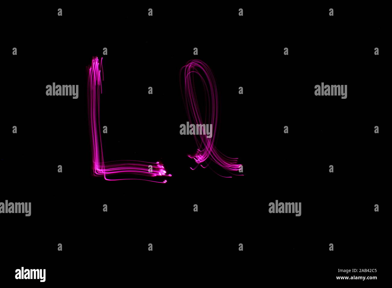 Parallel Letter L Long exposure photograph of the letter l in pink neon color, in upper ...