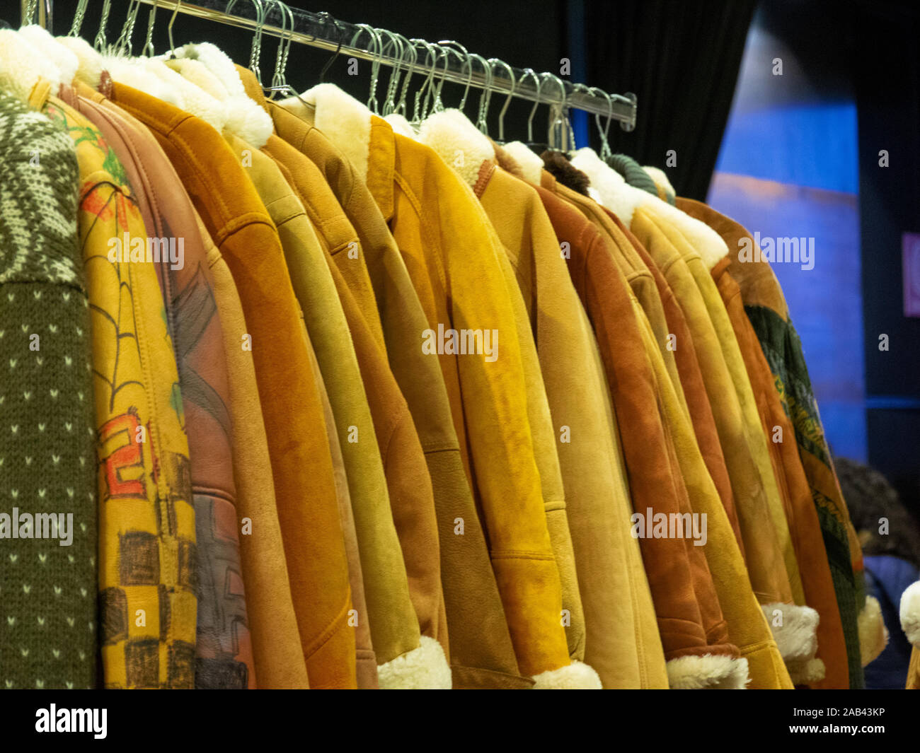 warm winter coats stuffed with fur at flea market Stock Photo