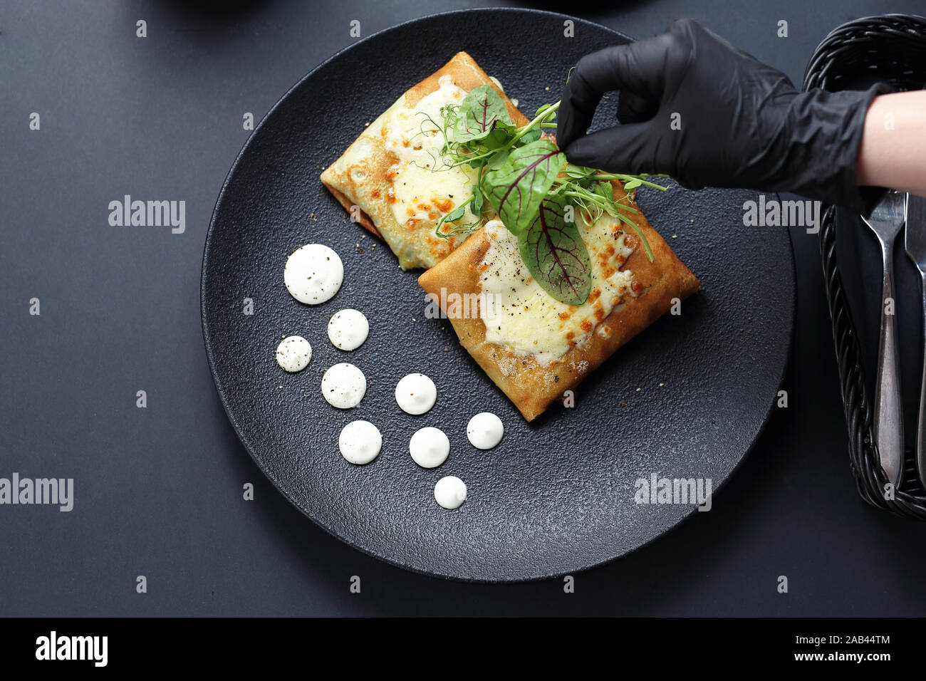 The chef decorates the plate. Serving and decorating the dish. Stock Photo