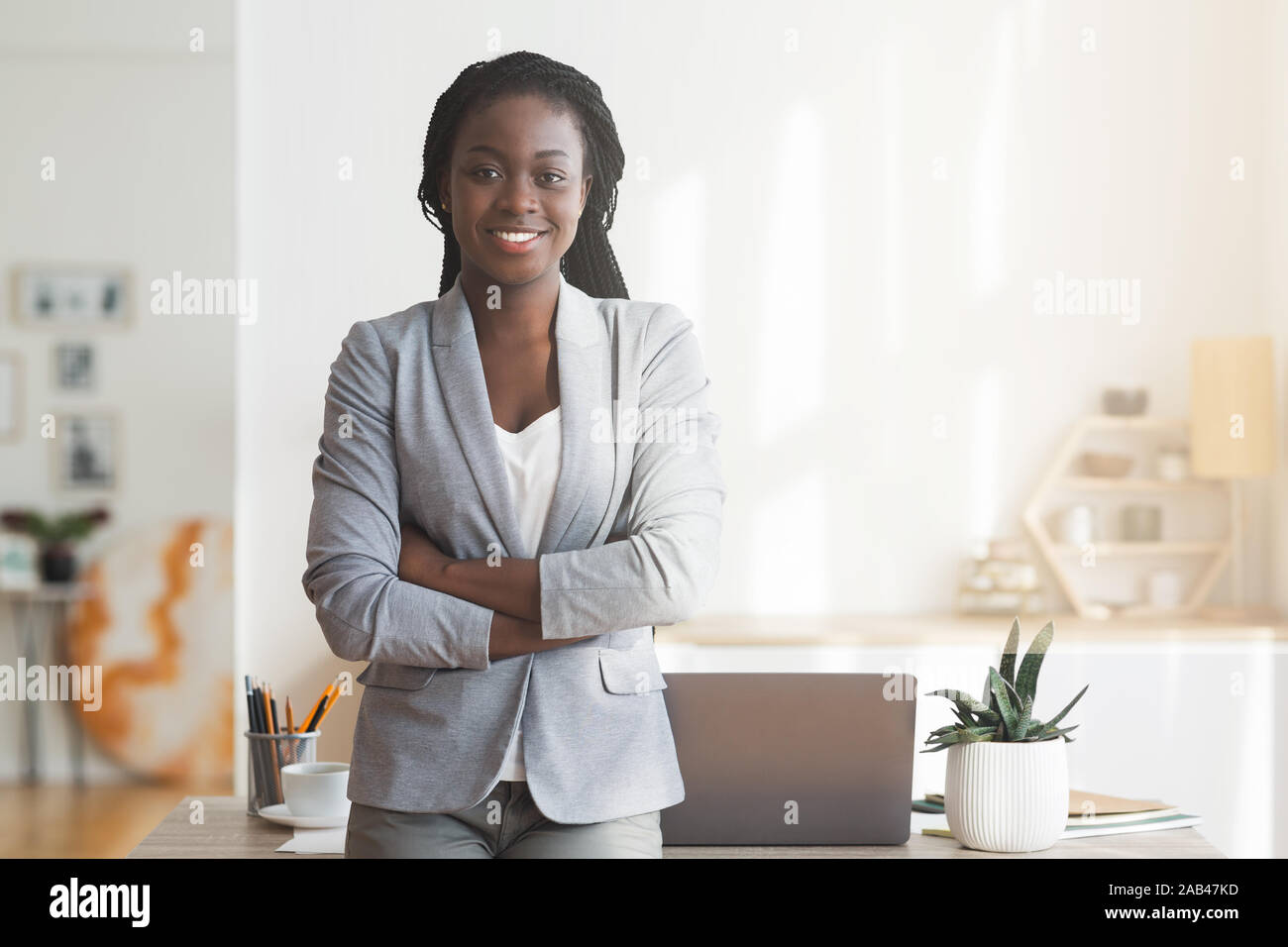 Successful Afro Businesswoman Posing In Office With Arms Crossed Stock ...