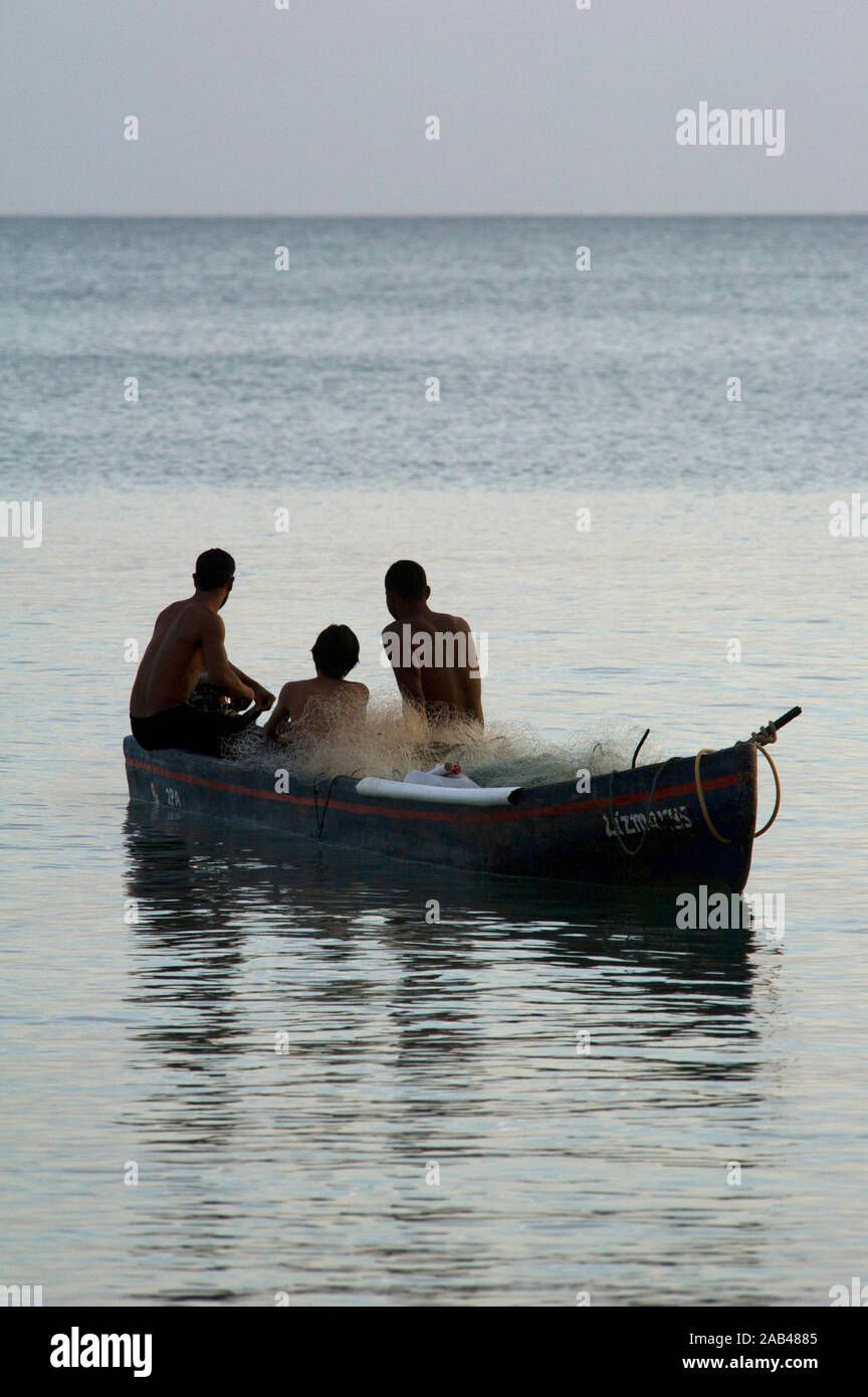 Young fishermen on a boat in the open ocean near Farallon village, Cocle Province, Panama Stock Photo
