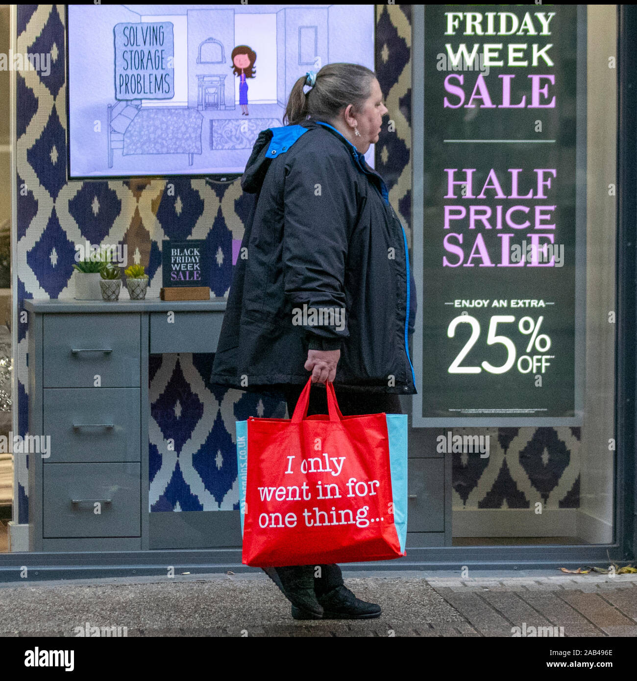 Preston, Lancashire. UK Weather. 25th November, 2019. Wet blustery day for Black Friday Event shoppers in Preston city centre as Black Tag sales get underway in Fishergate, and Christmas shoppers take advantage of the early bargains. Credit: MediaWorldImages/Alamy Live News Stock Photo