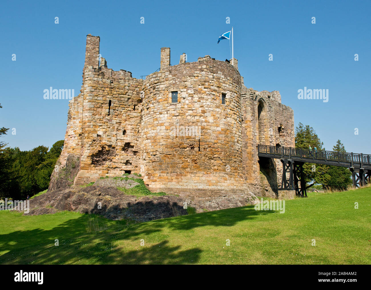 Dirleton Castle with defensive wide, wooden bridge and gatehouse. East