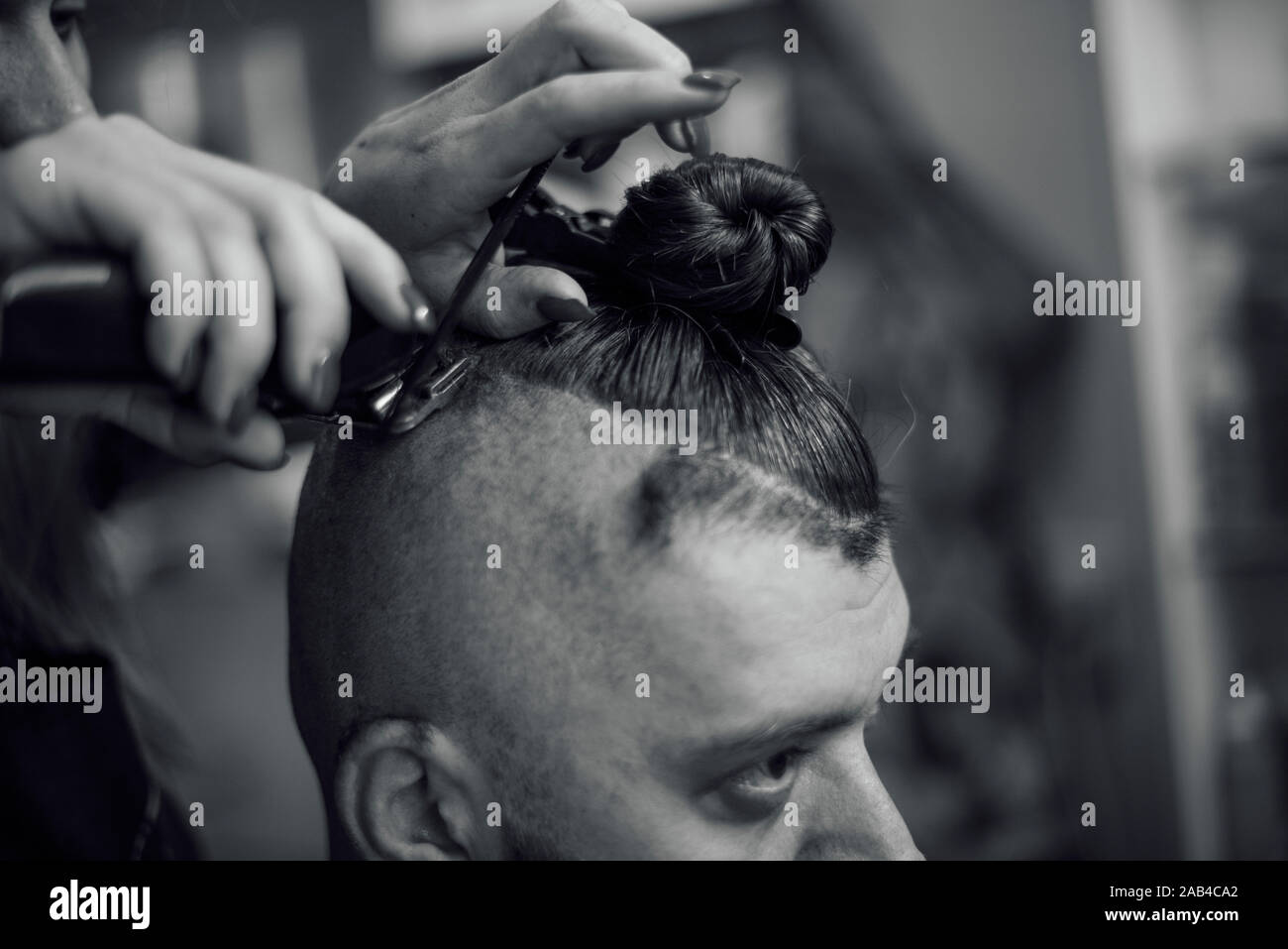 Male Hipster In Barbershop Barber On Fashionable Haircut A Man
