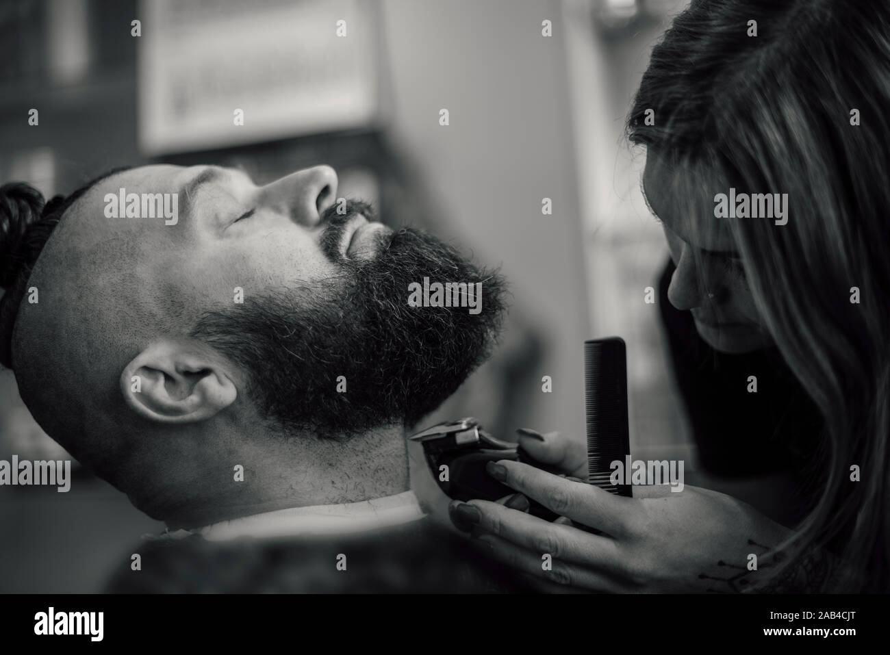 Male Hipster In Barbershop Barber On Fashionable Haircut A Man