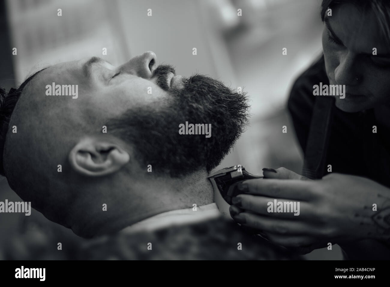 Male Hipster In Barbershop Barber On Fashionable Haircut A Man