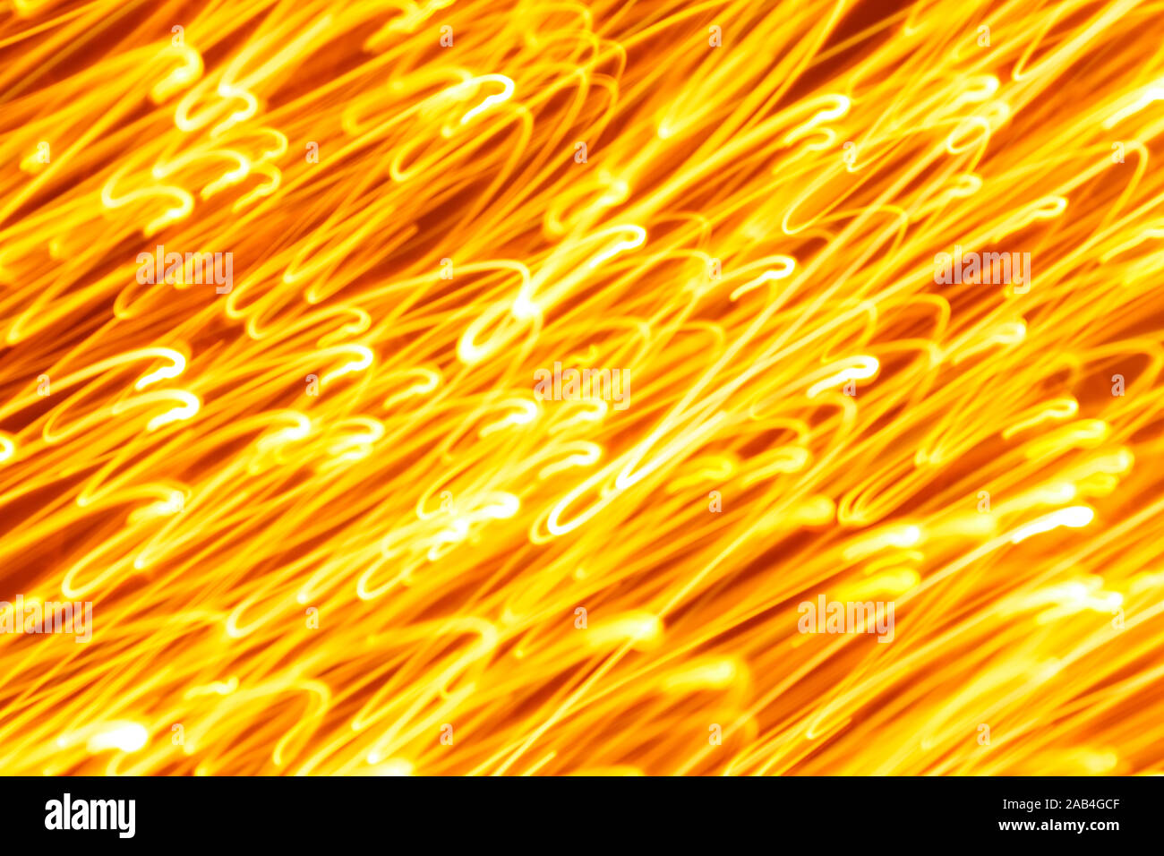Futuristic blurred lights holiday monochrome background in yellow. Horizontal, soft focus Stock Photo