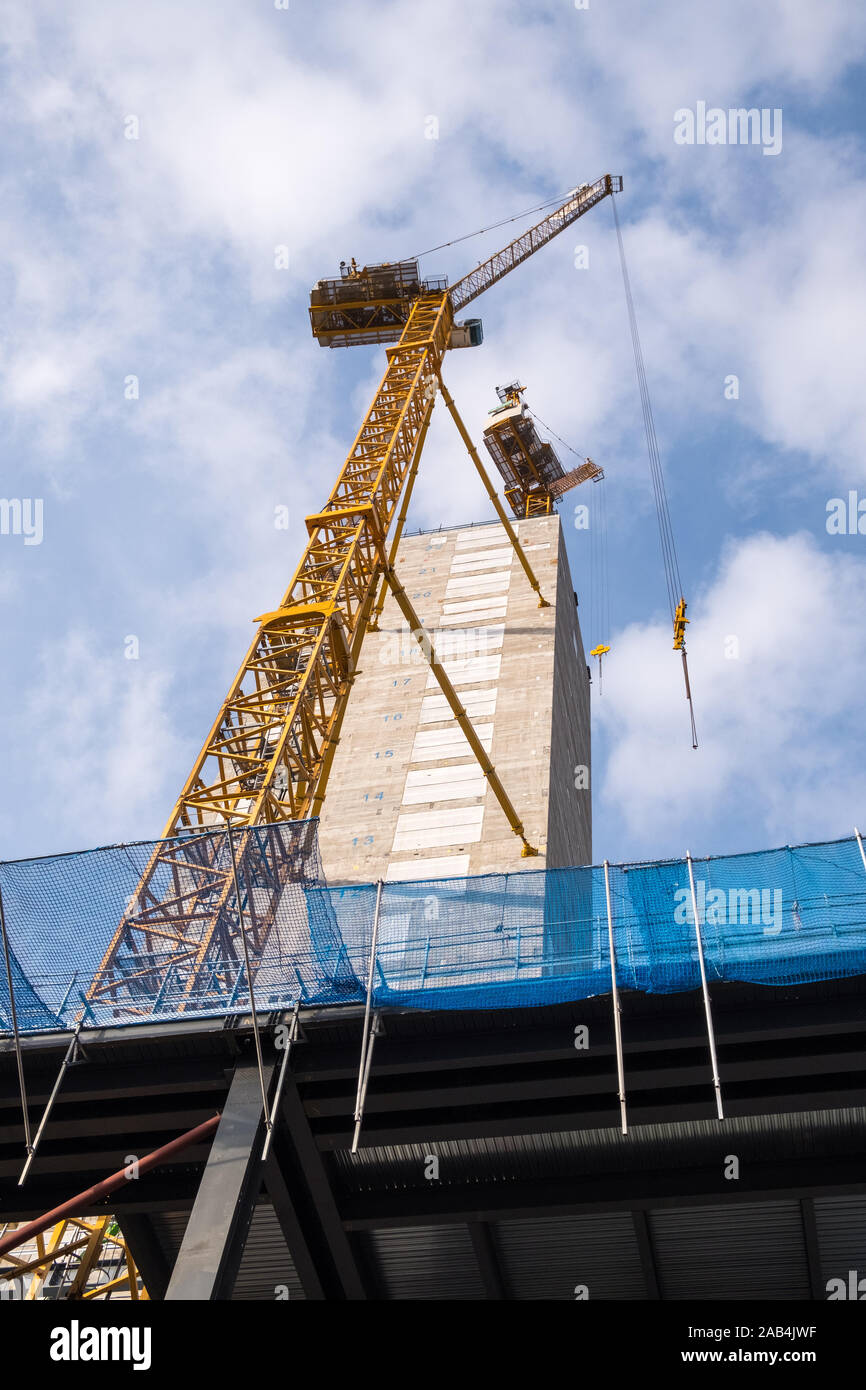 Crane attached to lift shaft of new tall office building being constructed on Newhall Street, Birmingham, UK Stock Photo