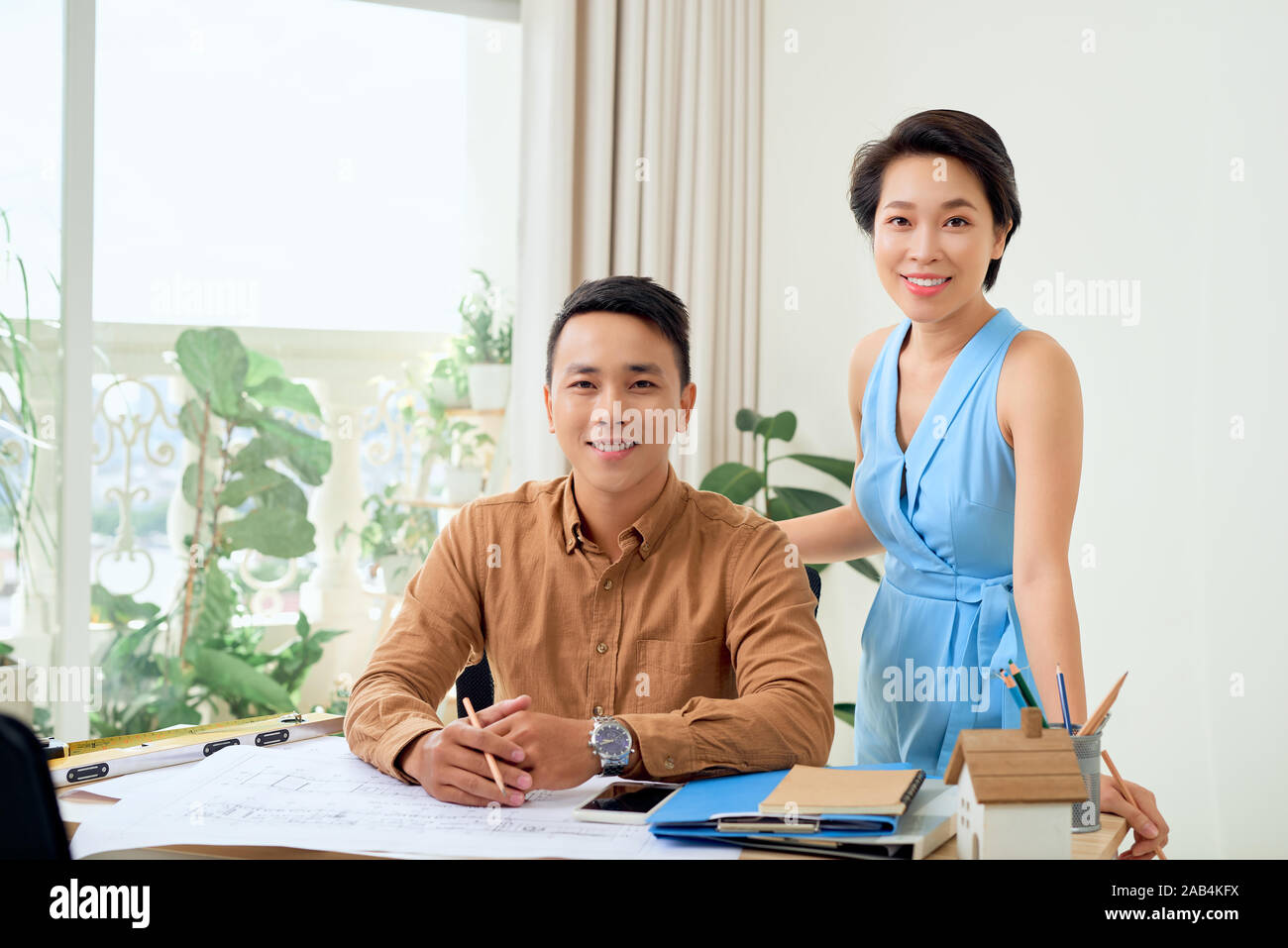 Happy architects workin on new business project Stock Photo