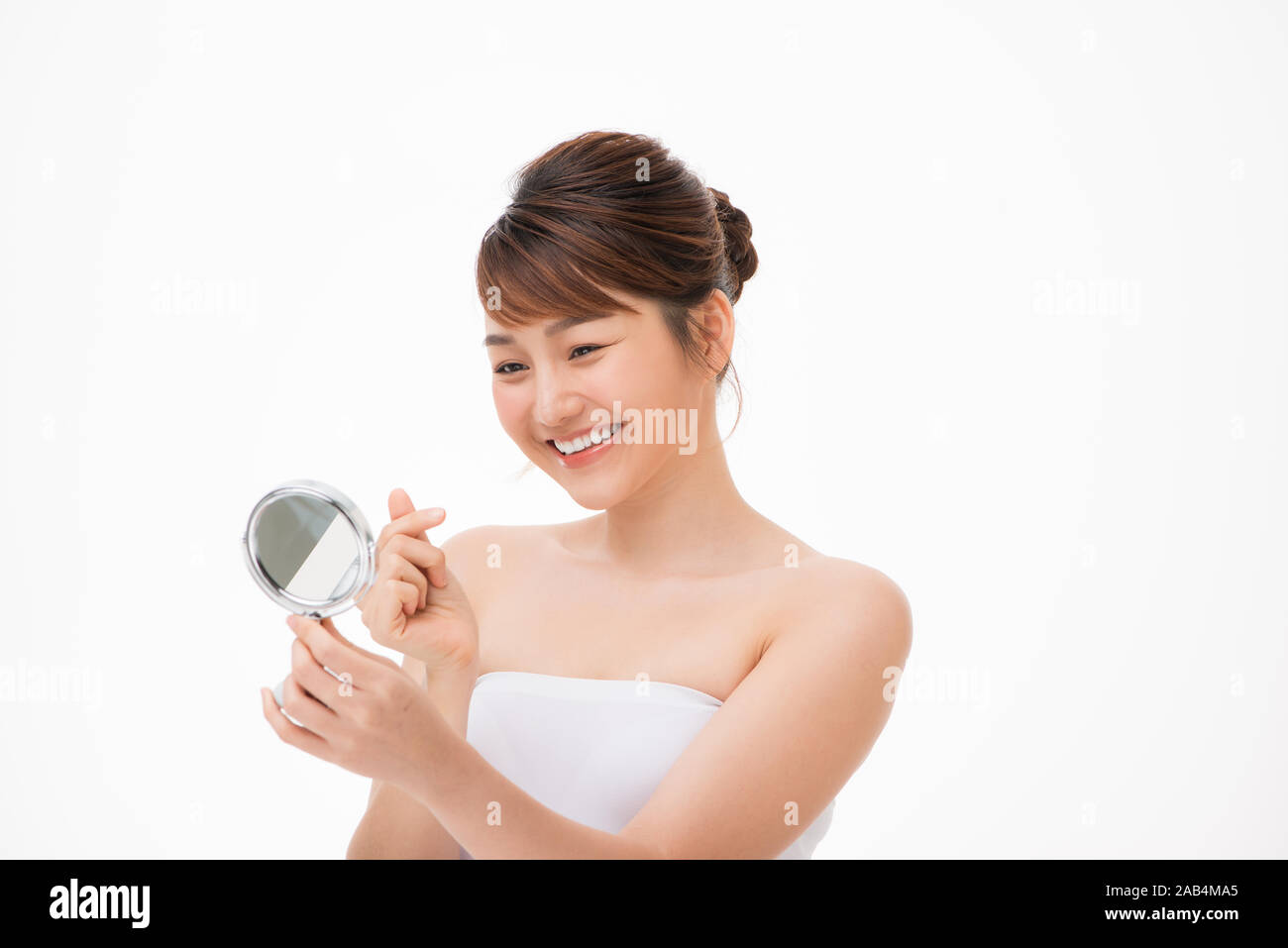 Woman inspecting skin mirror hi-res stock photography and images - Alamy