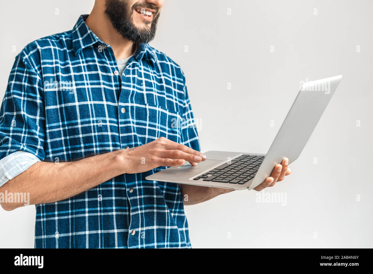Mature bearded man using modern laptop computer Stock Photo