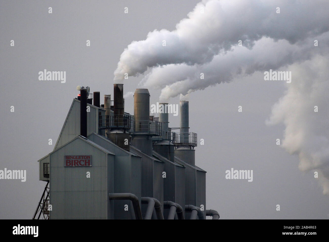 Smoke billows from factory chimneys, Lincolnshire, UK Stock Photo