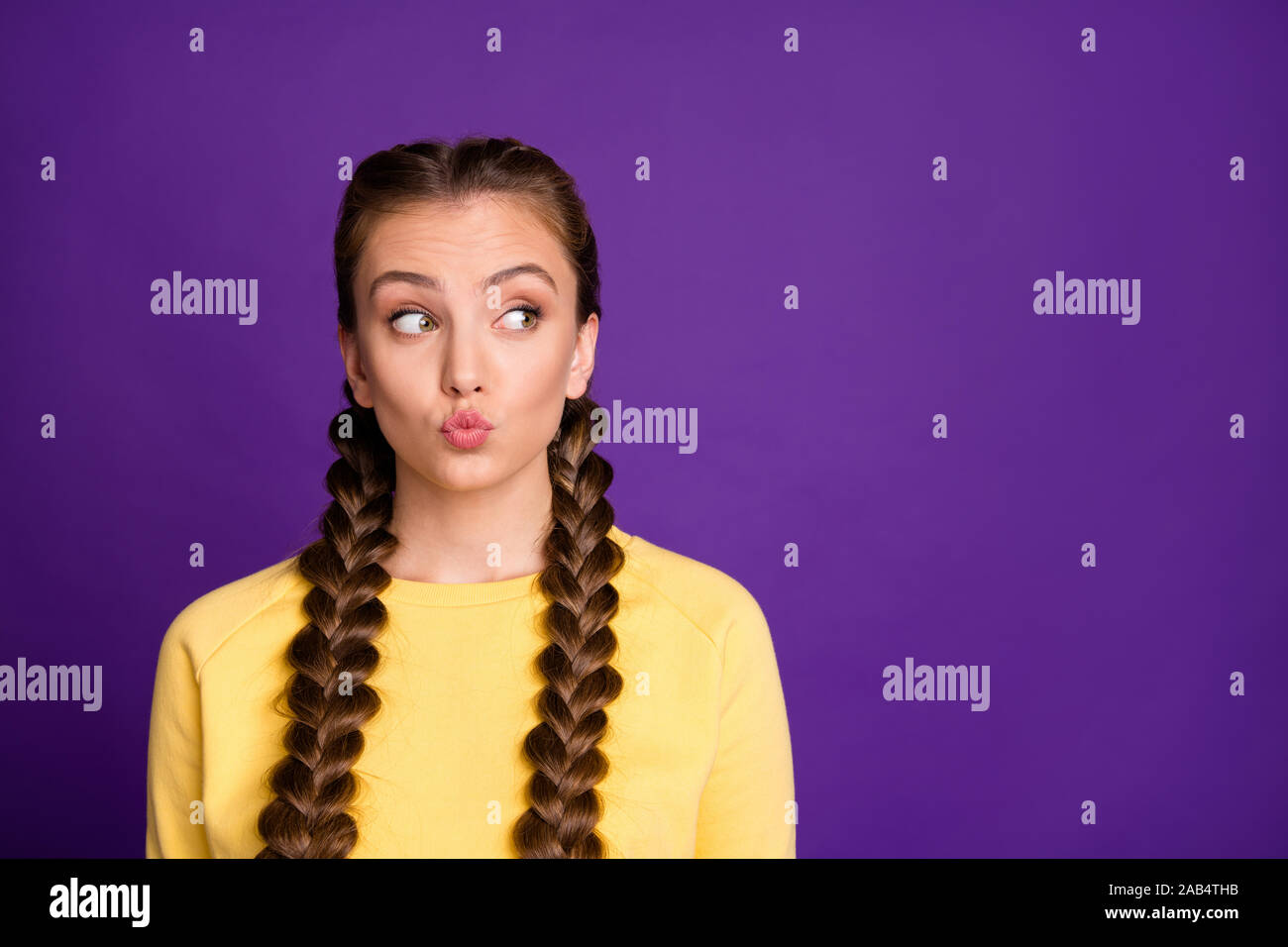 Photo Of Funny Expression Lady With Long Braids Hairdo Sending Air