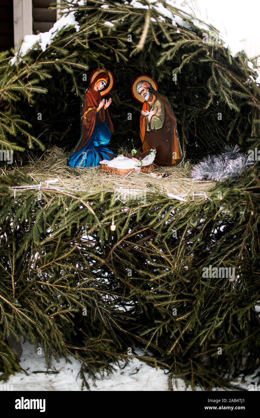 Christmas nativity scene represented with statuettes of Mary, Joseph and baby Jesus. Close up. Stock Photo