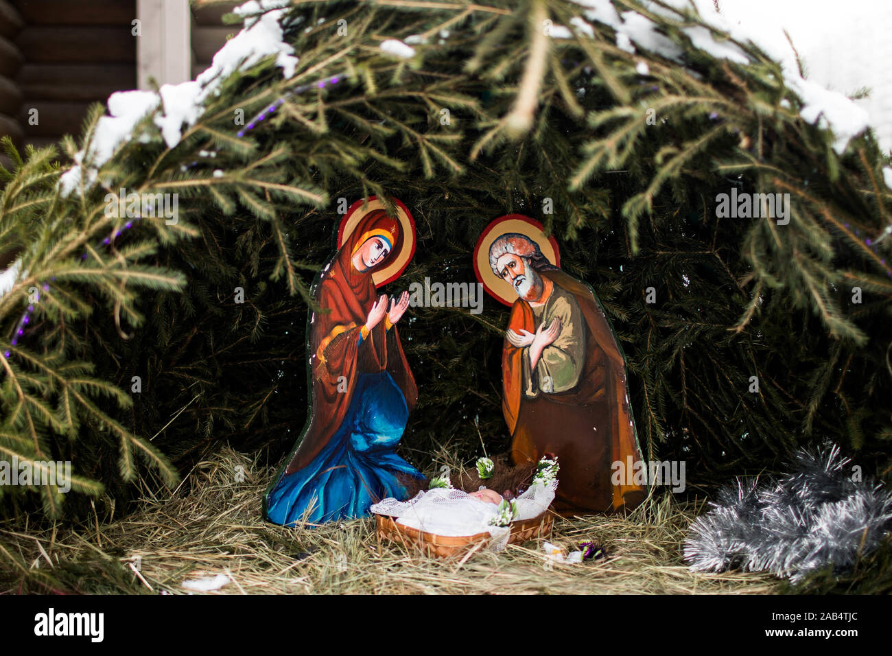 Christmas nativity scene represented with statuettes of Mary, Joseph and baby Jesus. Close up. Stock Photo