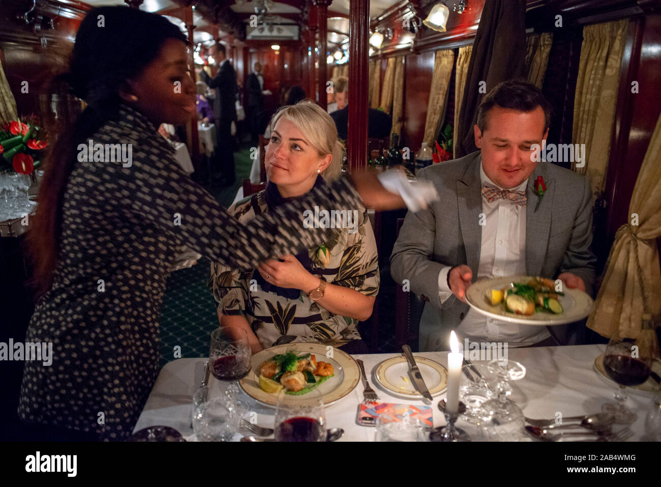 Passengers having dinner in the restaurant car of the The Rovos Rail ...