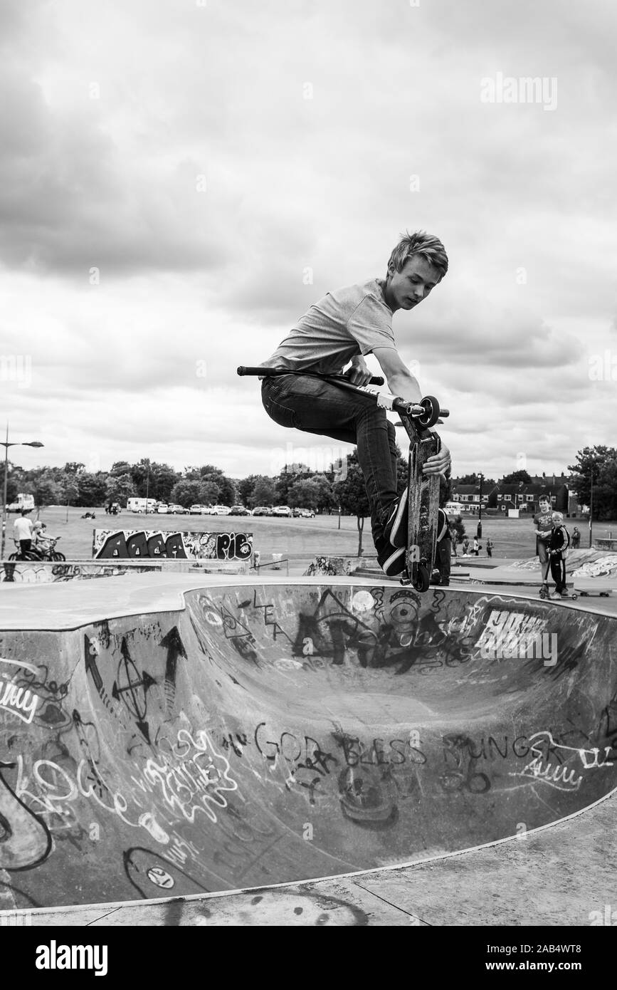 Professional scooter rider Josh Glass rides around the local skate park