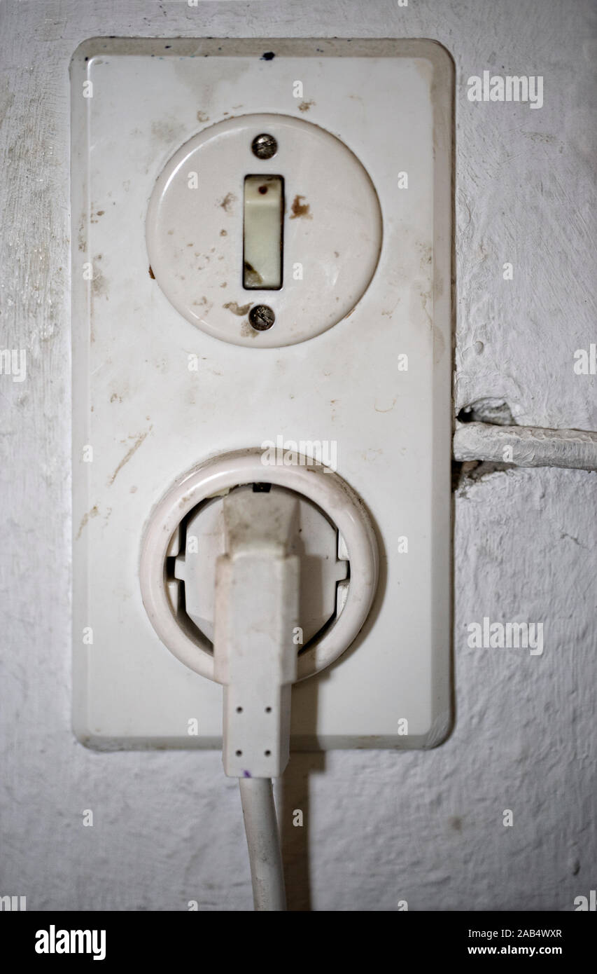 Old electrical socket and switch Stock Photo