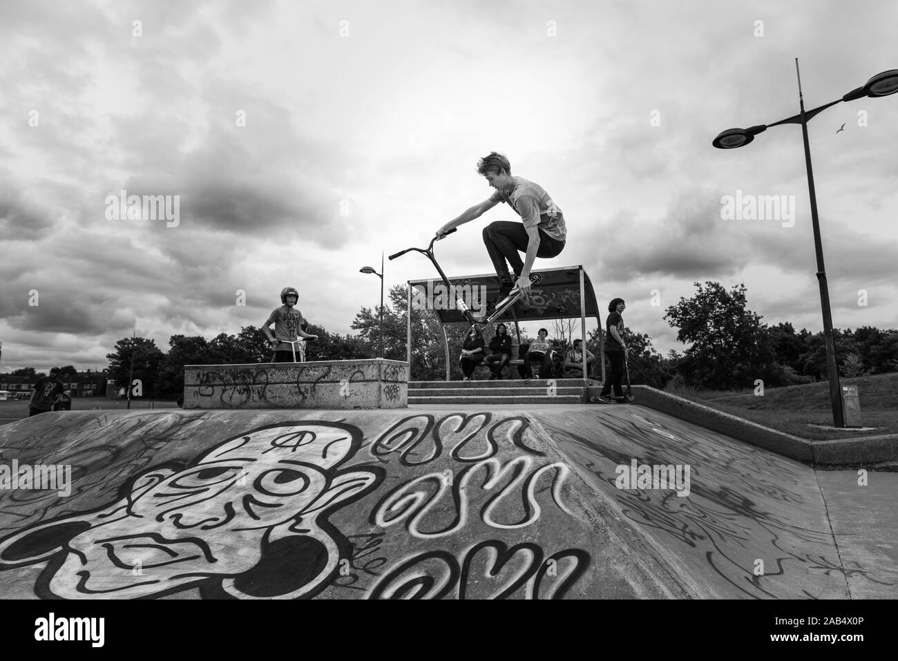 Professional scooter rider Josh Glass rides around the local skate park