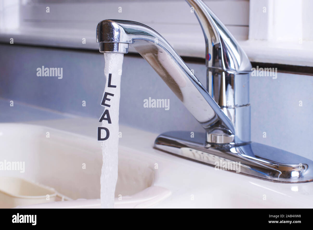 Lead In Running Tap or City Water, Lettering saying LEAD" is in the running water stream Stock