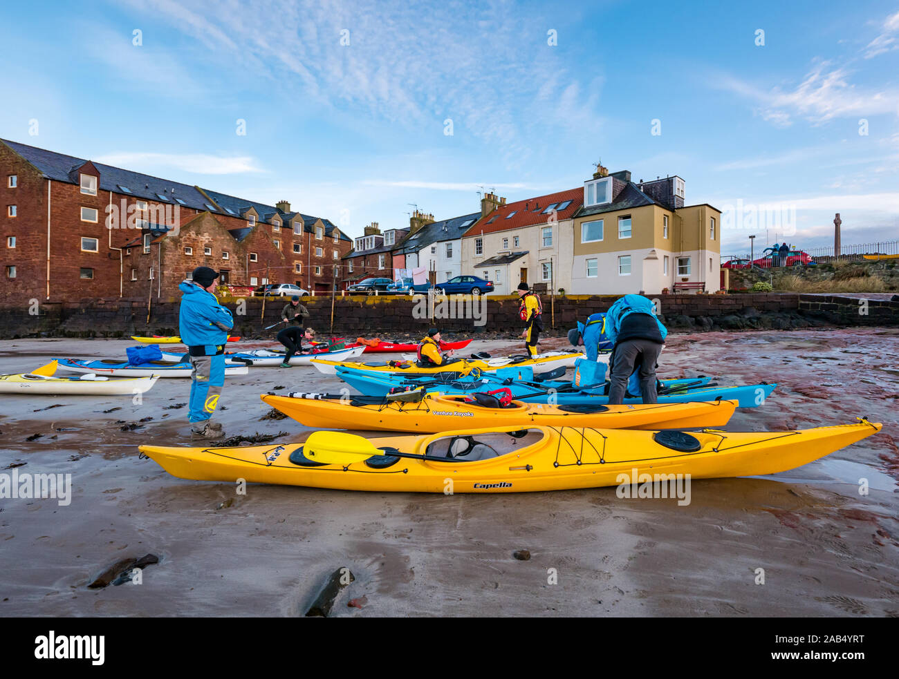 Lothian Sea Kayak Club group of kayakers make preparations before setting off from beach, North Berwick, East Lothian, Scotland, UK Stock Photo