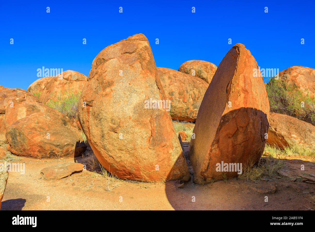 Two naturally split boulder in Karlu Karlu, Northern Territory, Australia. Devils Marbles Conservation Reserve are one of Australia's most famous Stock Photo