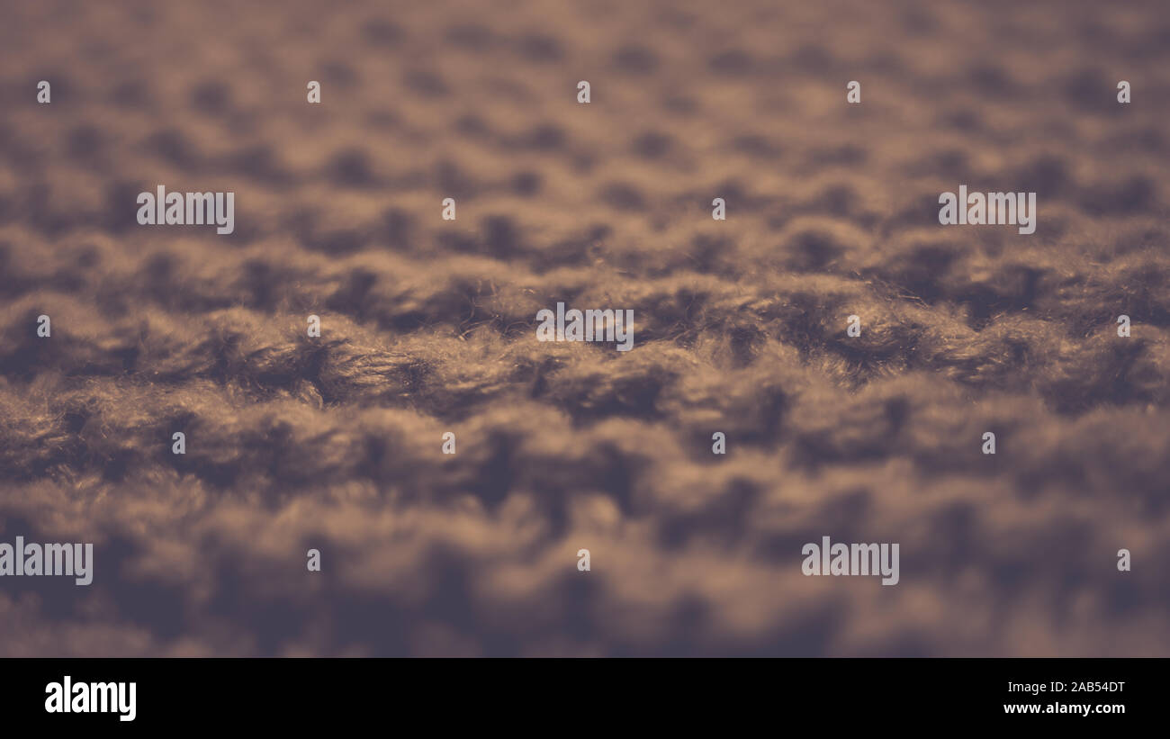 Knitted texture, brown thread pattern, cozy winter background. Stock Photo