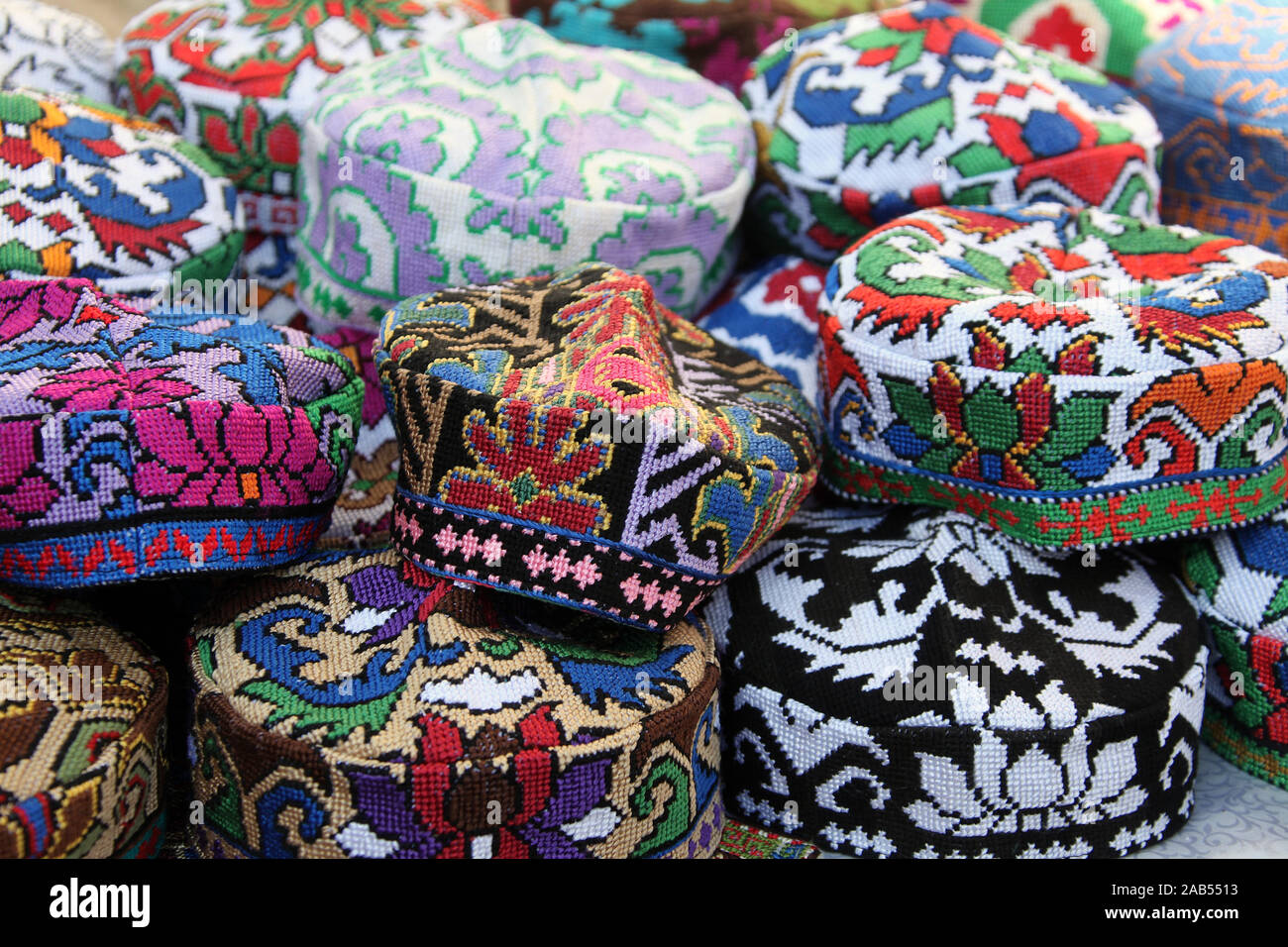 Beaded souvenir hats on sale in Central Asia Stock Photo