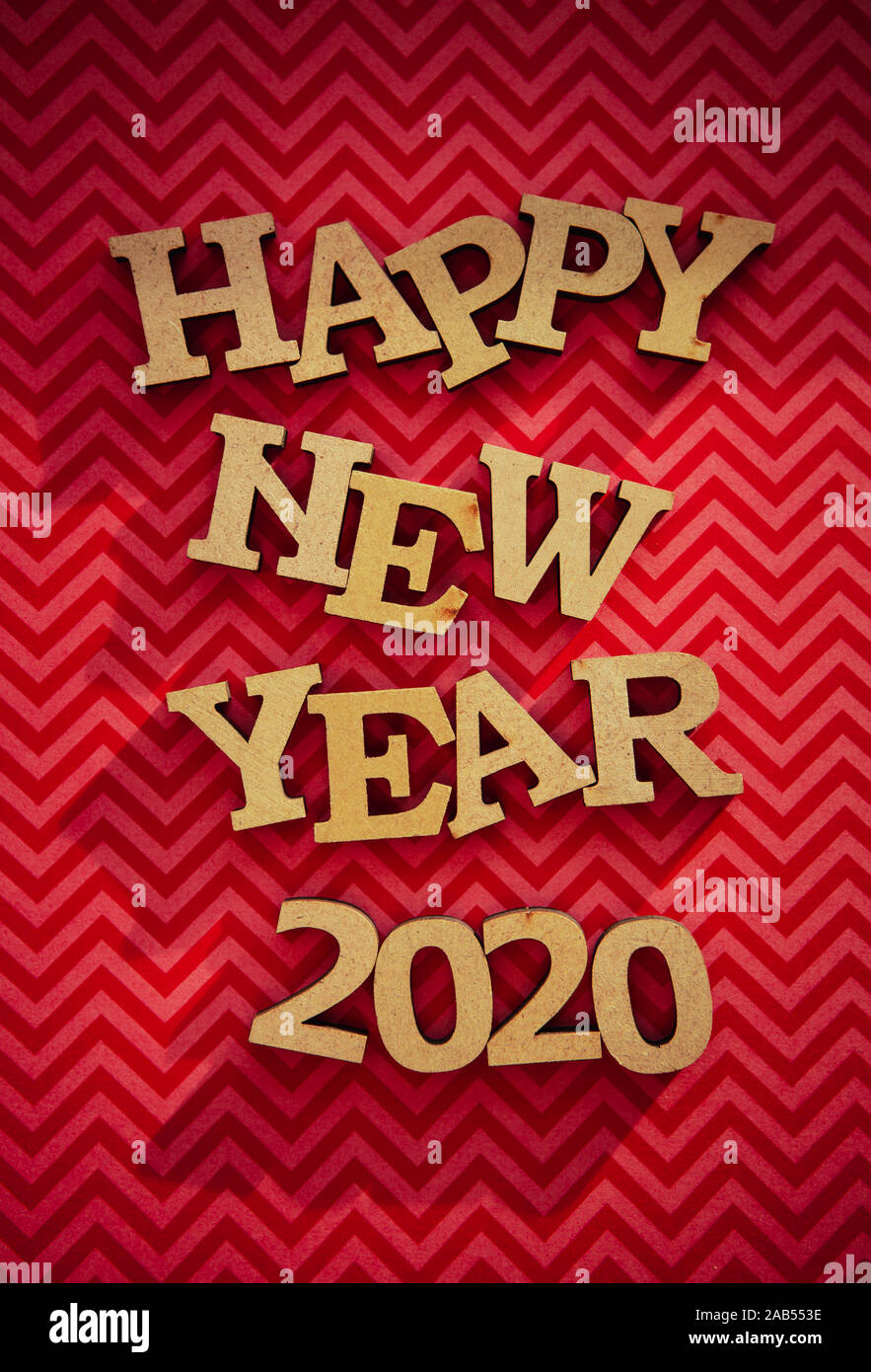 Happy New Year 2020 Background Hand Made Wooden Letters On Red