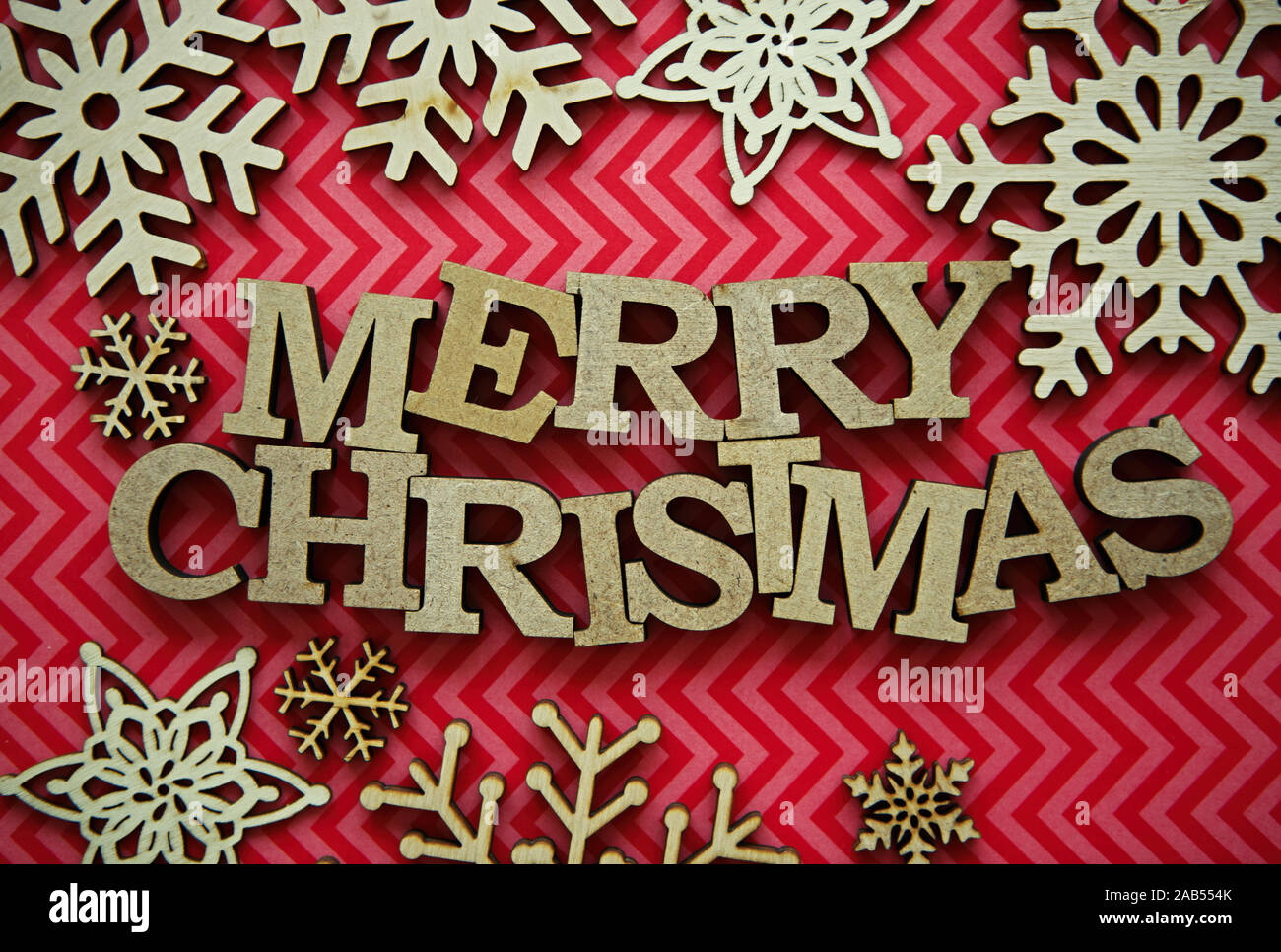 Merry Christmas Text On Red Background Rustic Wooden Letters In