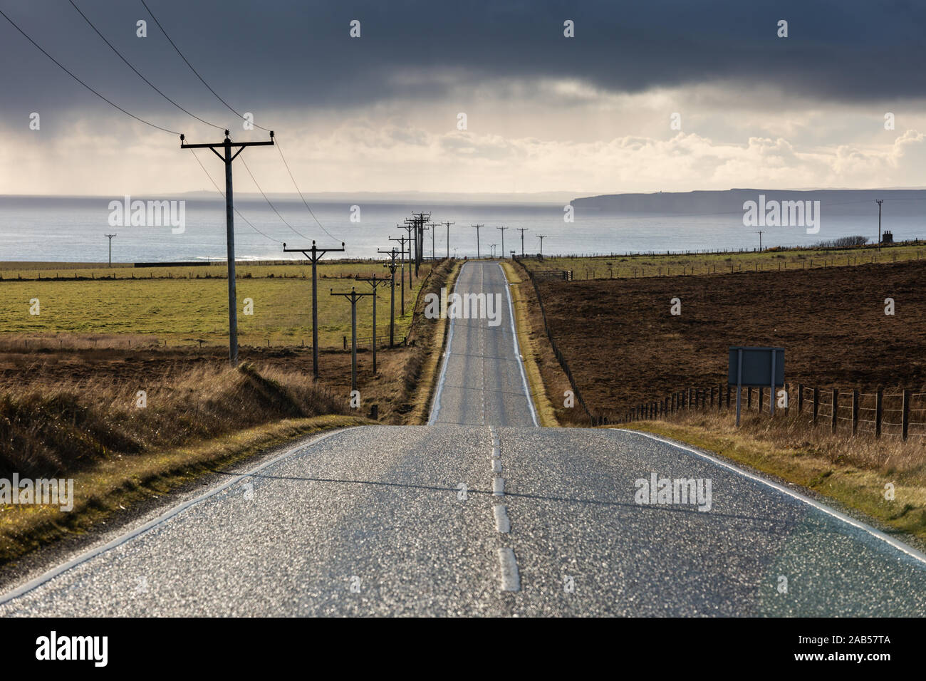 The A961 road through South Ronaldsay, Orkney Islands, UK Stock Photo