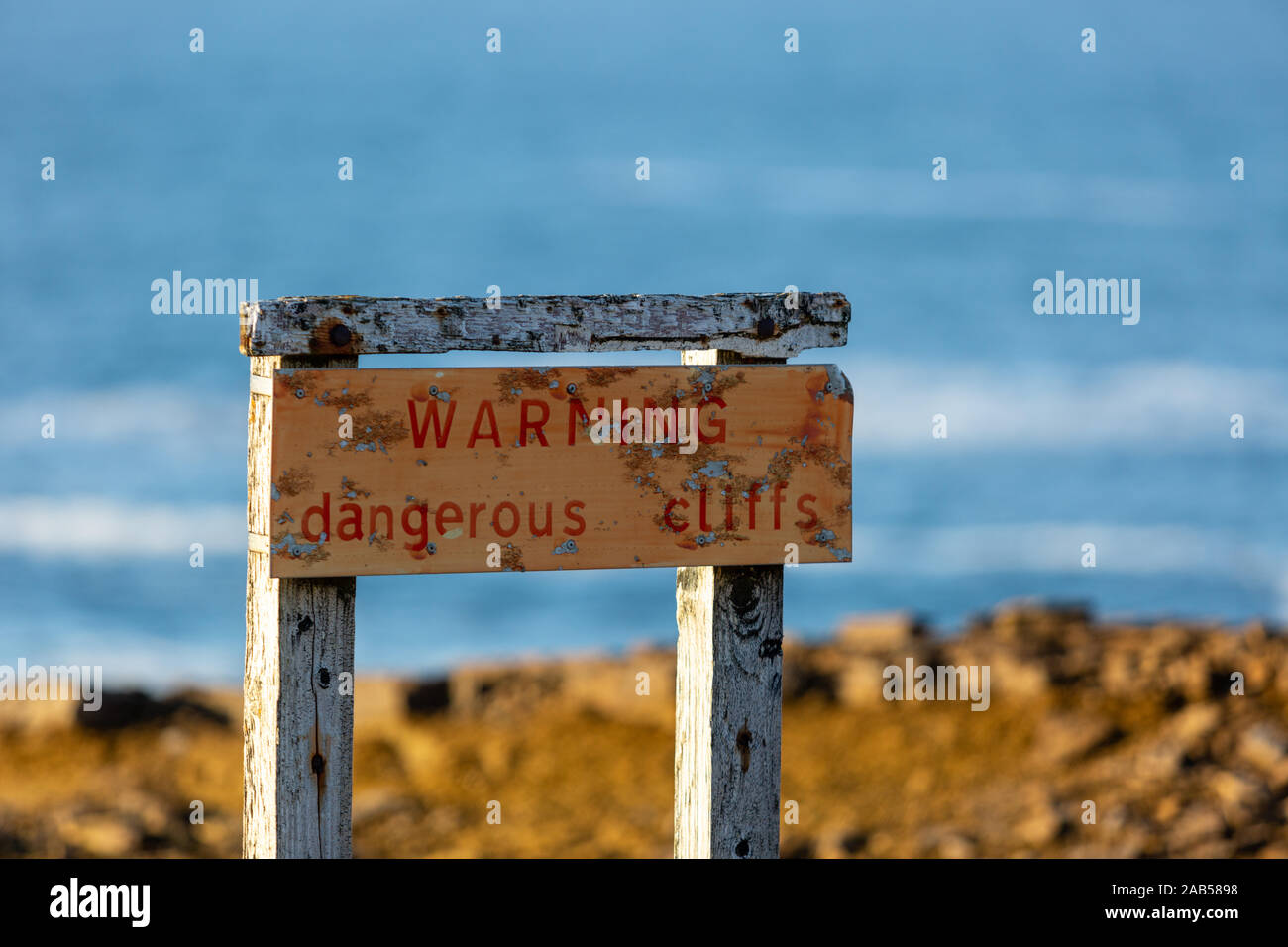 Warning sign at Yesnaby cliffs, Orkney, Scotland, UK Stock Photo