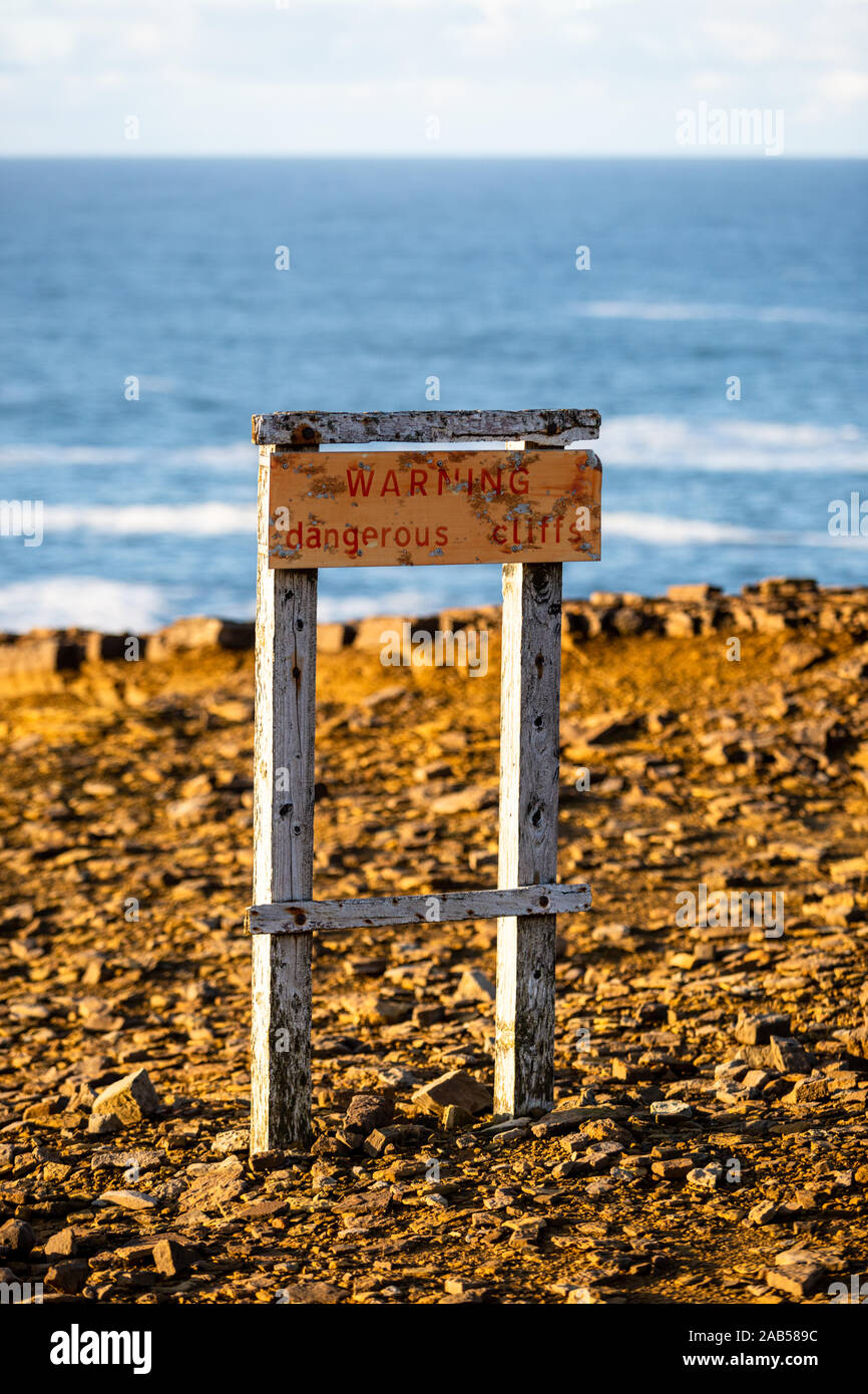 Warning sign at Yesnaby cliffs, Orkney, Scotland, UK Stock Photo