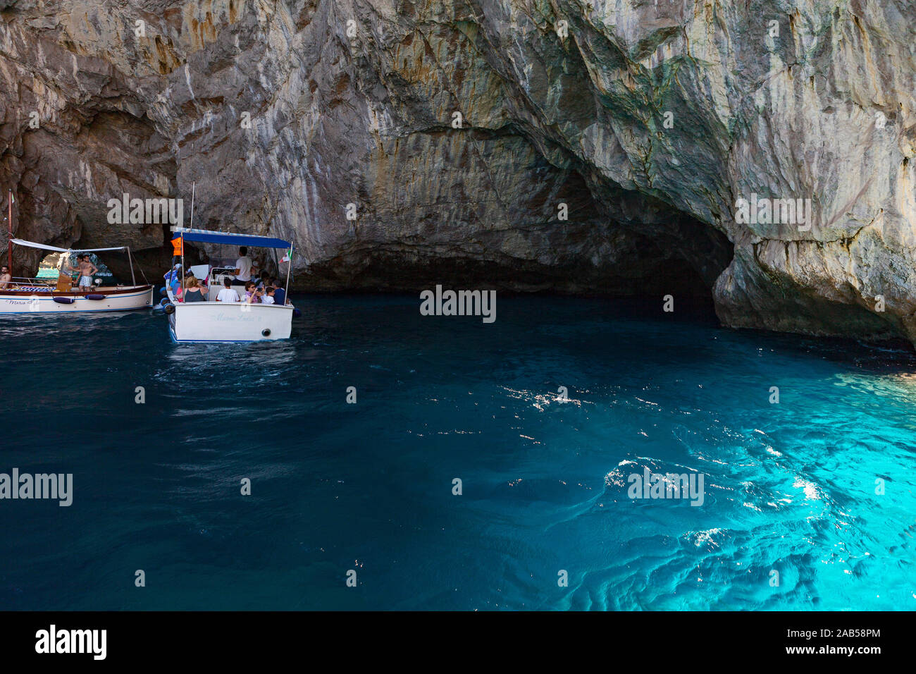 Exploring caves during boat ride around Capri Stock Photo - Alamy