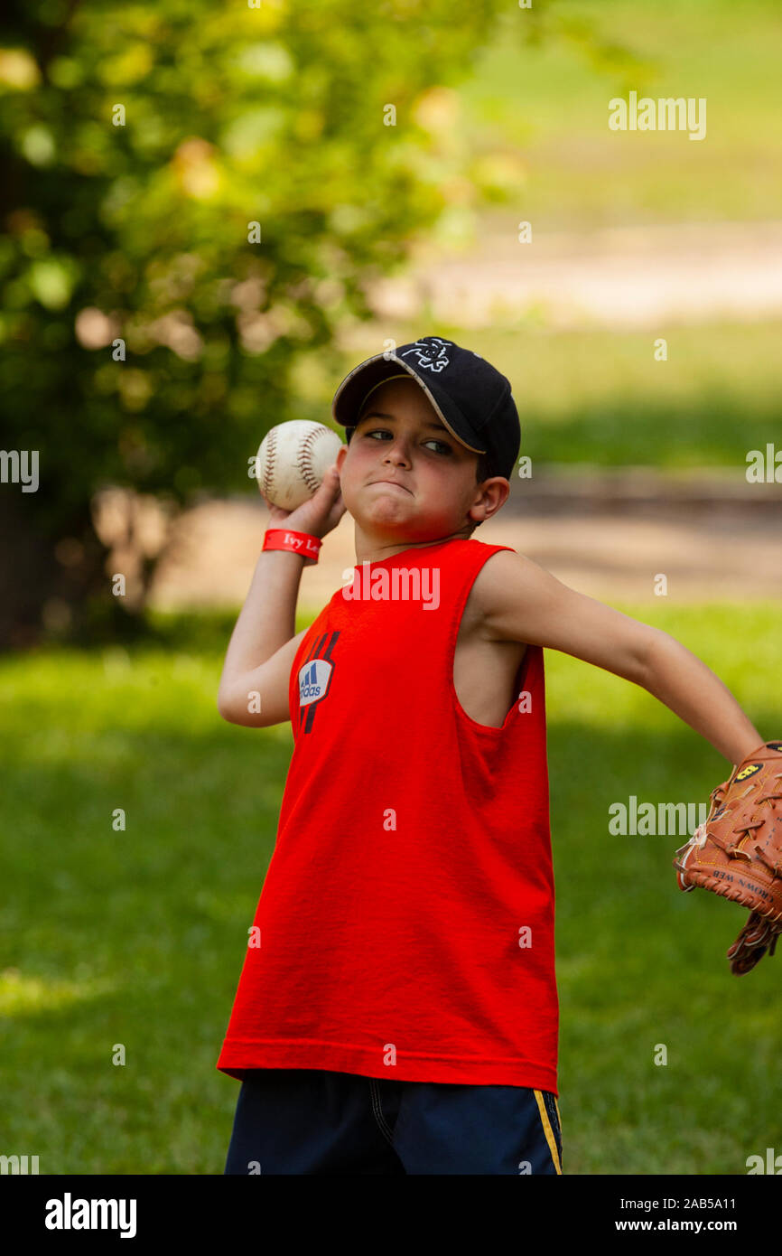 Boys playing softball at day camp Stock Photo Alamy