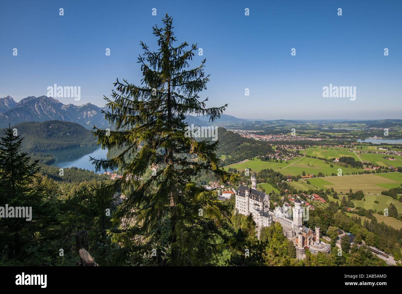View from the ascend to the Tegelberg at Neuschwanstein Castle, in the background right of the Forggensee, left the Alpsee, Schwangau near Füssen, Swa Stock Photo